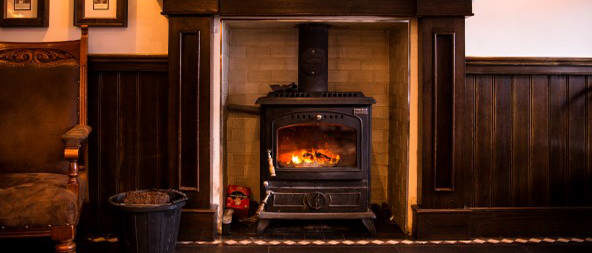 Relax by the fire at The Midway Dungloe